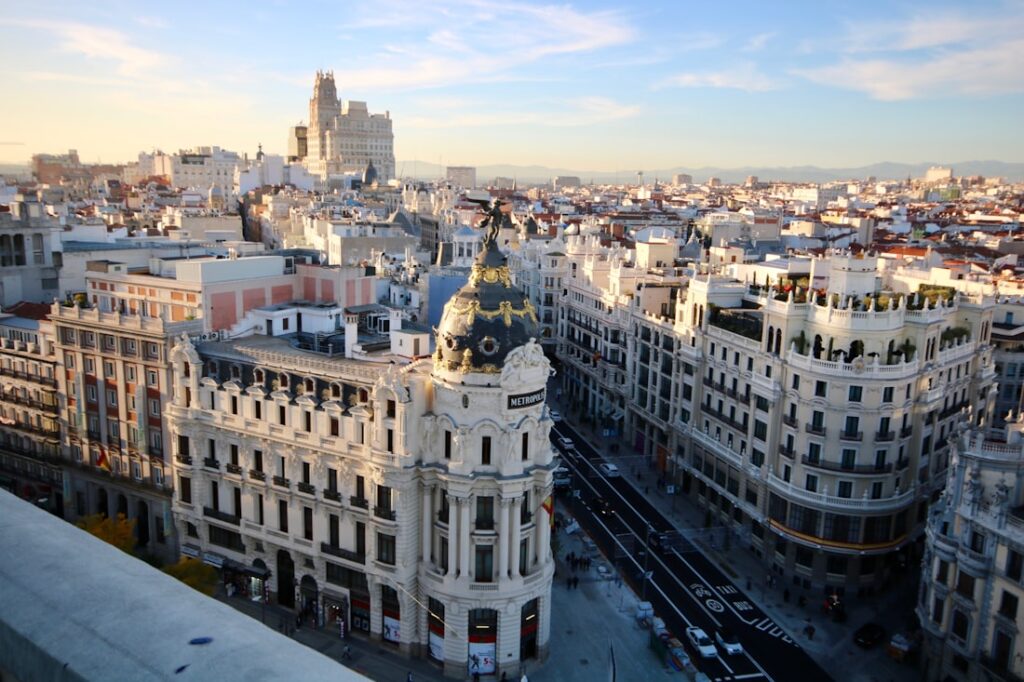 Gran Via in Madrid at street level, historic facades under open sky